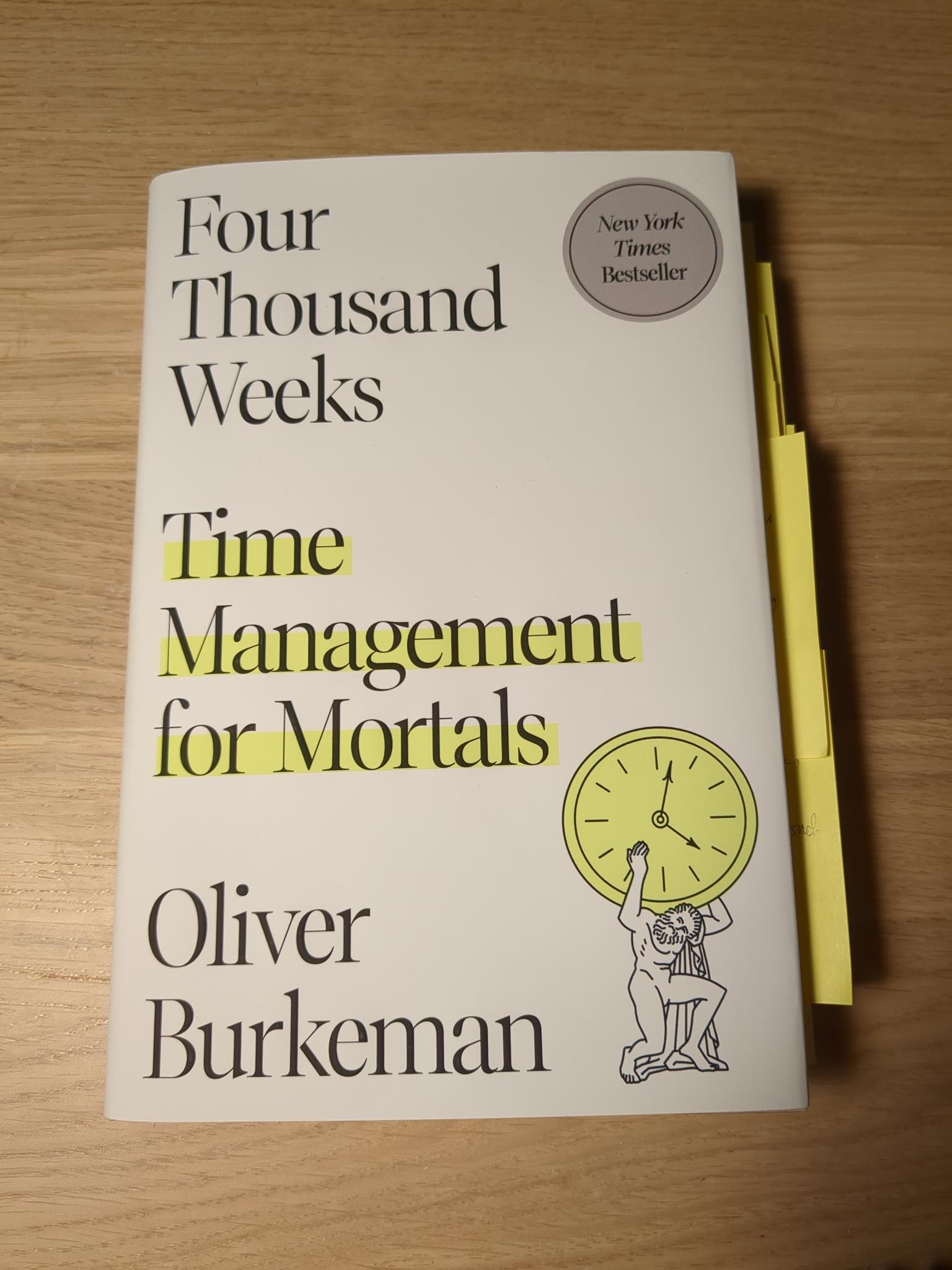 Four Thousand Weeks Four Thousand Weeks book in softcover form on top of a desk